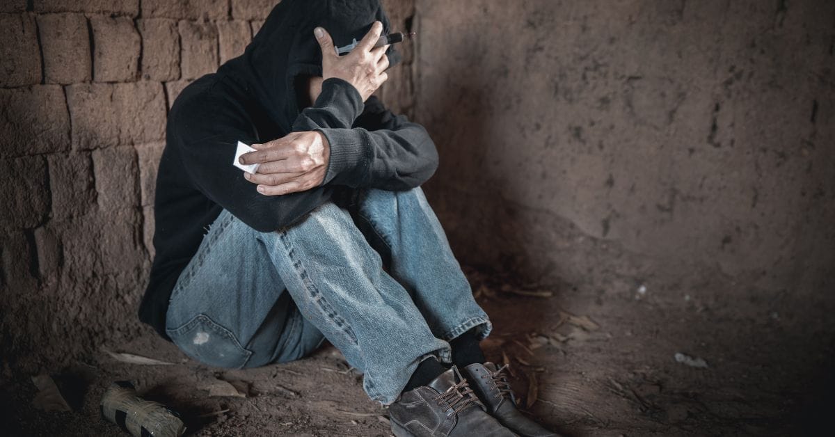 Drug addict man sleeping after using different types of drugs
