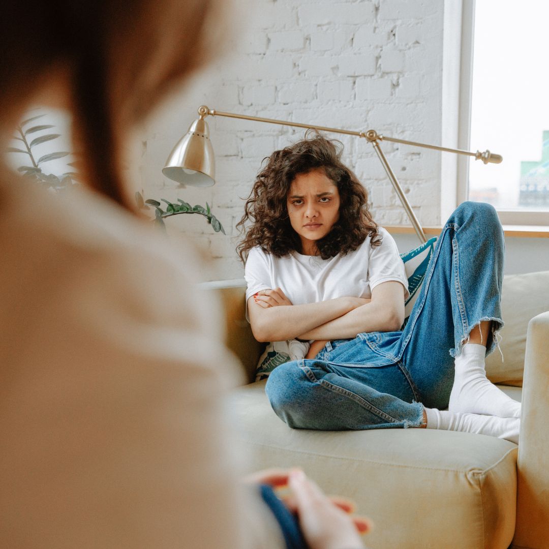 Upset Woman Listening to Therapist