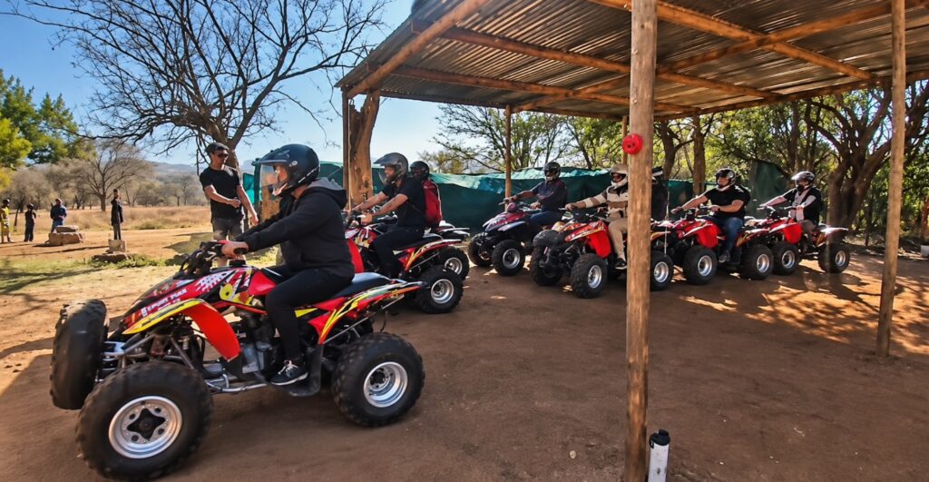 ATV Riders Under a Rustic Shelter