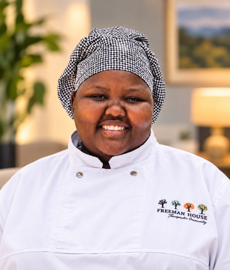 Kamogelo Teane | Chef at Freeman House Recovery, pictured in a white chef uniform and patterned head covering