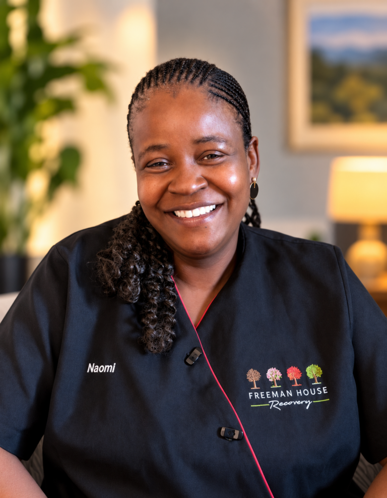 Naomi Mokate | Housekeeper at Freeman House Recovery, pictured in a black uniform